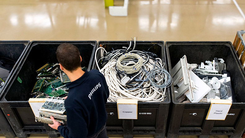 Philips employee separating out parts and materials