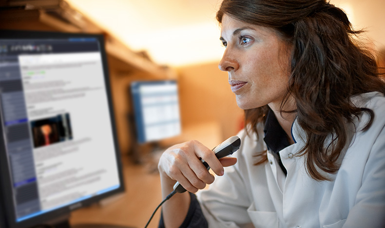 A radiologist dictating a report